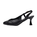 A single black leather slingback pump with a low kitten heel, side cutout, and a small gold-tone buckle on the ankle strap, shown against a plain white background.