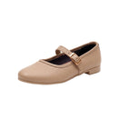 A single women's Mary Jane flat shoe in light tan pebbled leather with a gold buckle strap, shown from a side profile on a white background.
