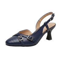 A single navy blue faux-leather slingback pump with a chunky black kitten heel and double buckle straps across the toe, shown on a white background.