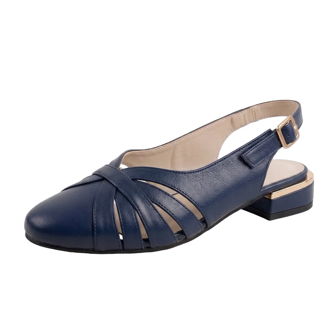 A navy blue leather slingback sandal with cutout straps, a low block heel, and a gold buckle, shown on a reflective white surface.