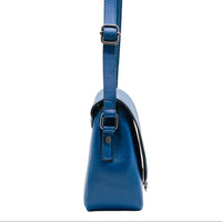 Blue handbag with a strap on a white background