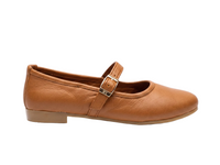 A single tan leather Mary Jane flat shoe with a silver buckle strap, shown in a side profile on a white background.