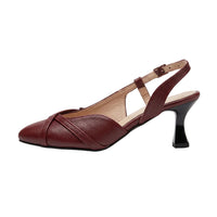 A single women's slingback pump in burgundy leather with a pointed toe, crisscross strap detail, and a black block heel, shown on a light beige textured surface against a white background.