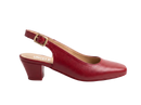 A single red leather slingback pump with a low block heel and gold buckle, shown in profile against a white marble background. The brand name 'UNCLE' is printed on the insole.