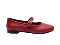 A single red leather Mary Jane flat shoe with a silver-tone buckle strap, shown in profile against a white background.
