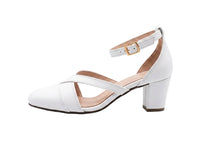 A white faux leather block heel sandal with a low block heel, criss-cross front straps, and an ankle strap with a gold buckle, shown in profile against a white background.