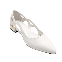 A white pointed-toe slingback flat shoe with cutout details on the upper and a low block heel, photographed on a clean white background.